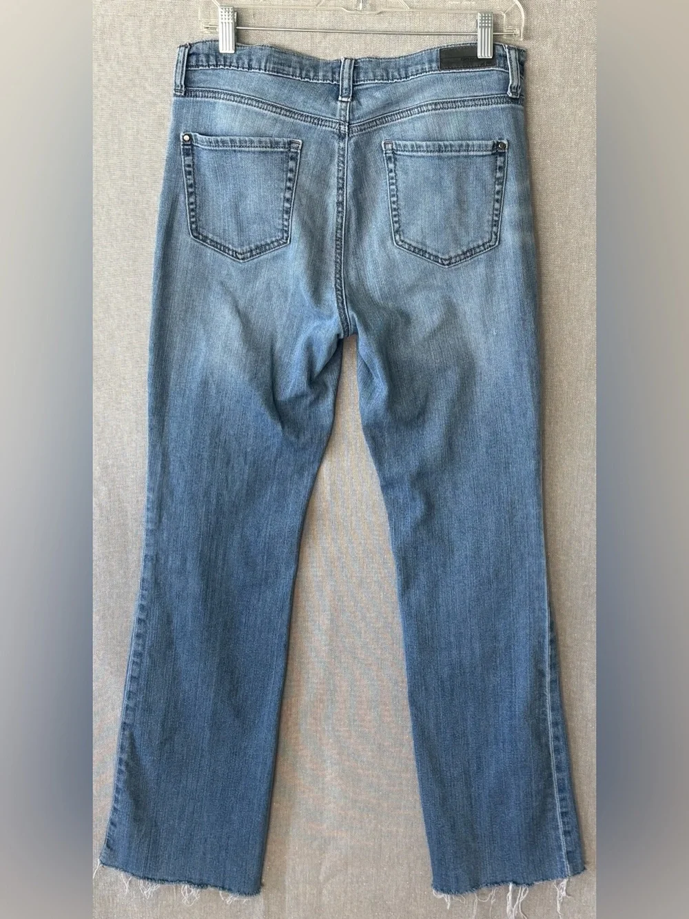DKNY soho boot Women's Light Wash Blue Jeans size 6 fringe hem.